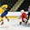 GRAND FORKS, NORTH DAKOTA - APRIL 18: Sweden's Jesper Bokvist #10 jumps out of the way as the puck sails wide Switzerland's Matteo Ritz's #30 goal during preliminary round action at the 2016 IIHF Ice Hockey U18 World Championship. (Photo by Minas Panagiotakis/HHOF-IIHF Images)

